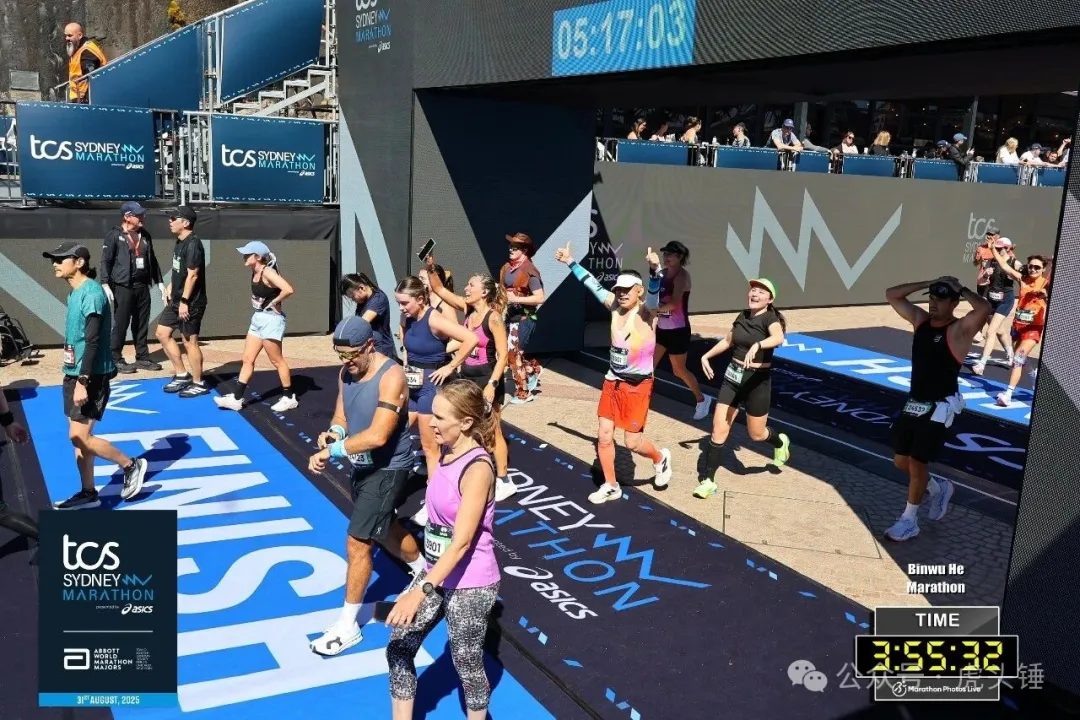 Lao He crosses a marathon finish line
